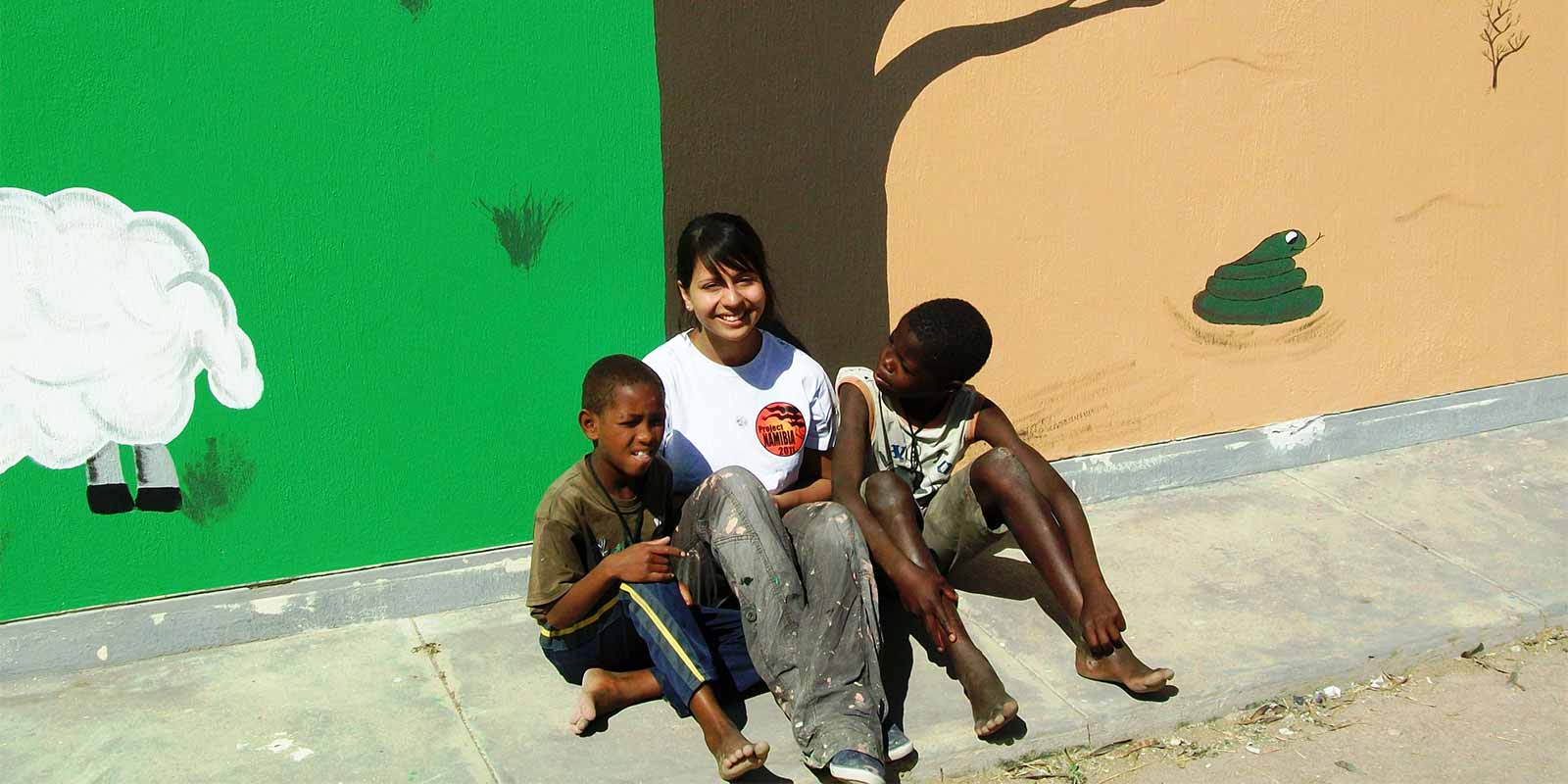 Student with local children at Namibia community project