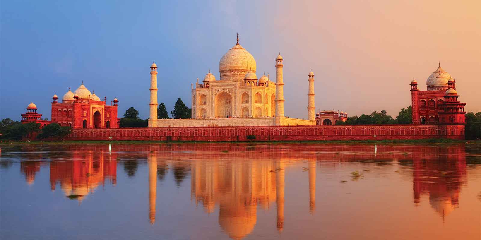 View of Taj Mahal with reflection and red hue