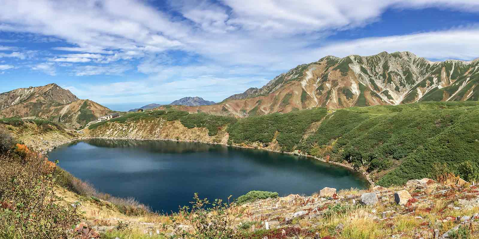 View of Murodo Peak with lake below in the Japanese Alps