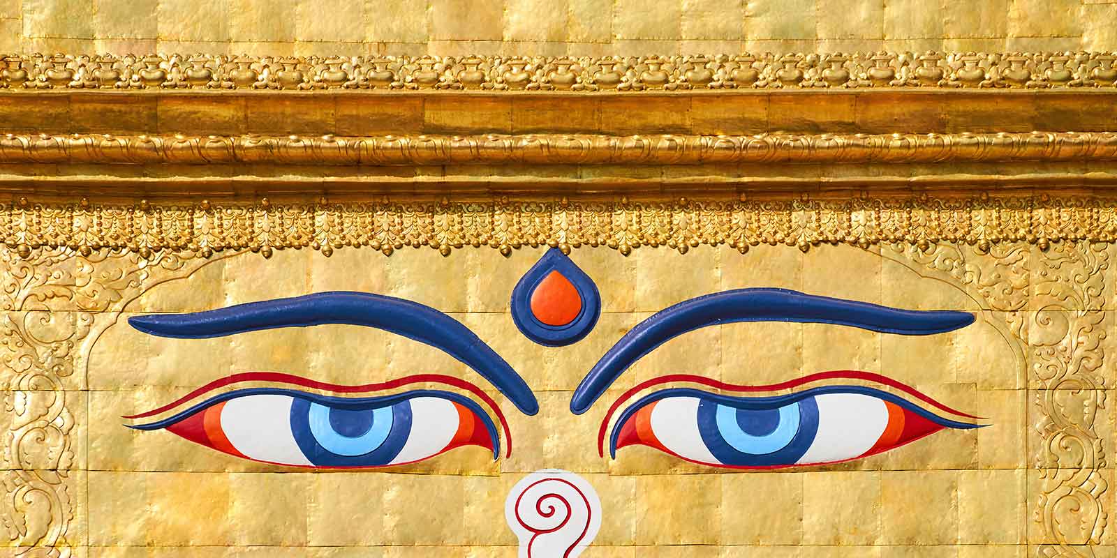Eyes of Buddha on gold background at Boudhanath stupa