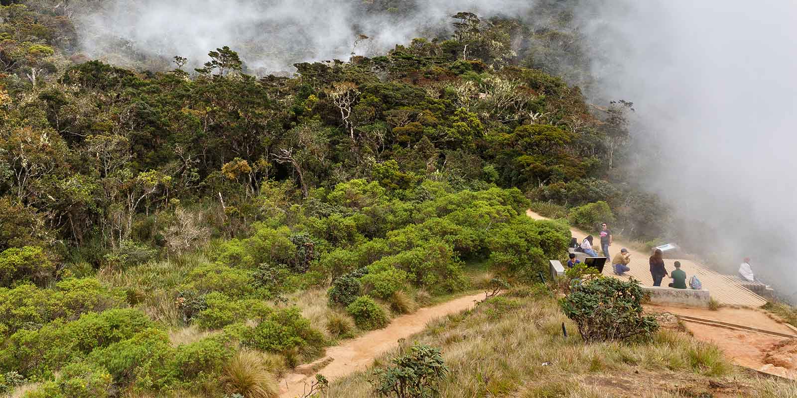 Group at World's End wtih mist rising over Horton Plains