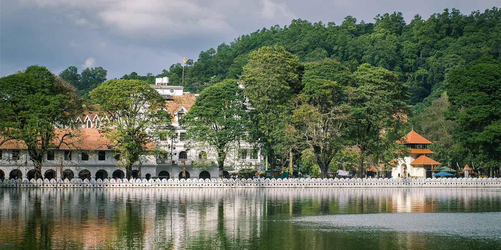 Royal Palace complex housing the Temple of the Tooth with Kandy Lake in foreground