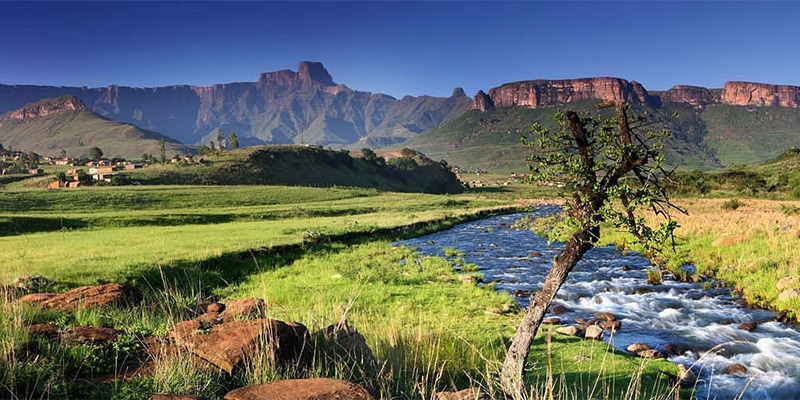 South African river valley with mountain ridge in background.