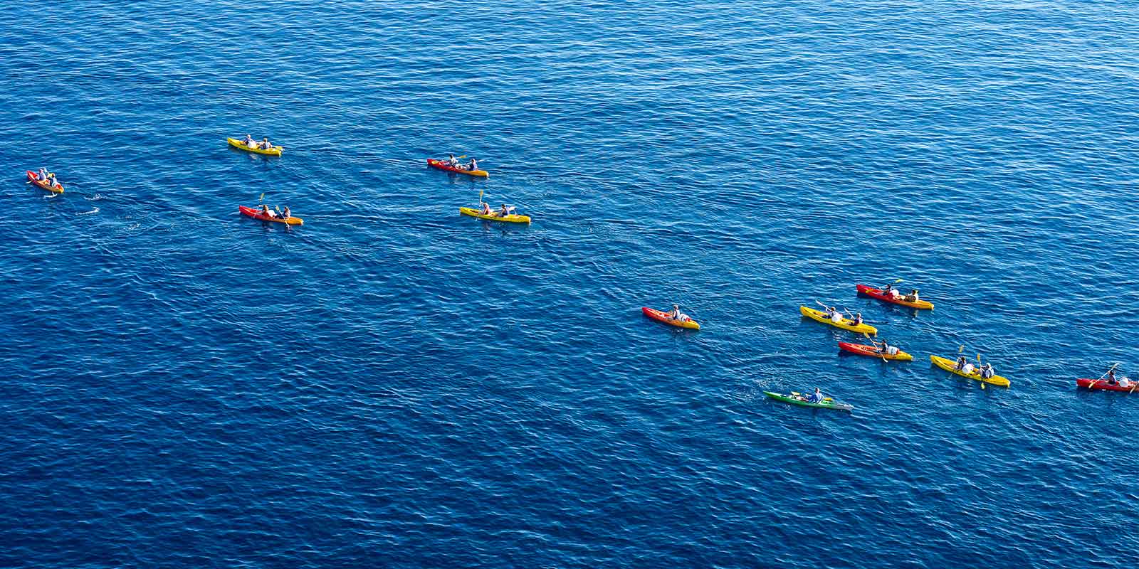 Group of kayakers in the Adriatic sea around the coast of Dubrovnik