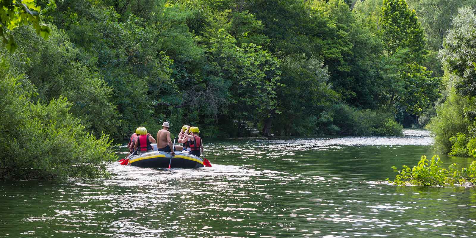 Group rafting on a river in Croatia