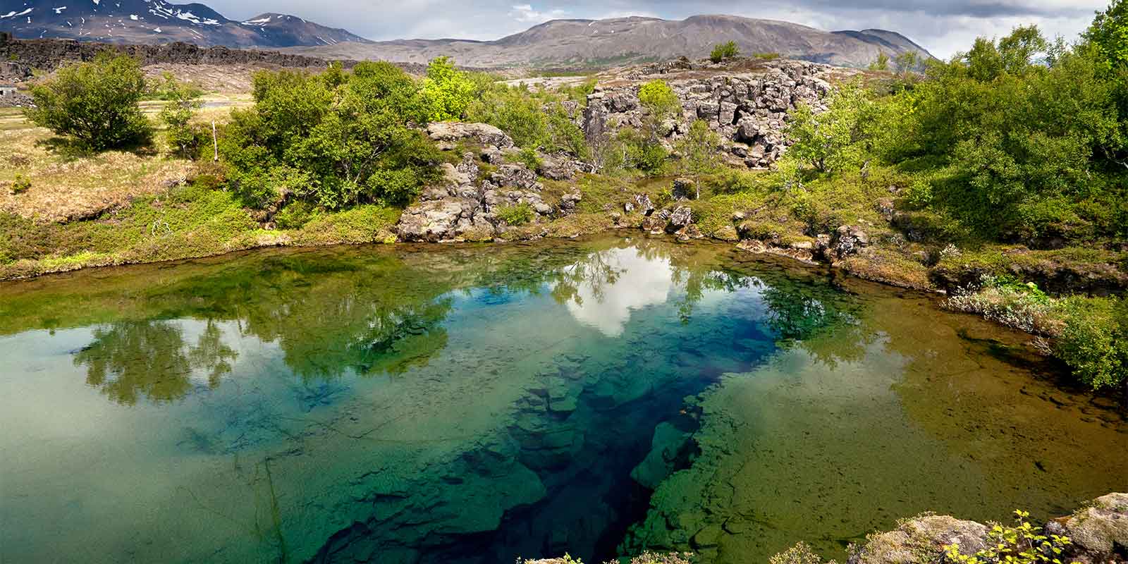 A lake and deep fissure in Thingvellir National Park 