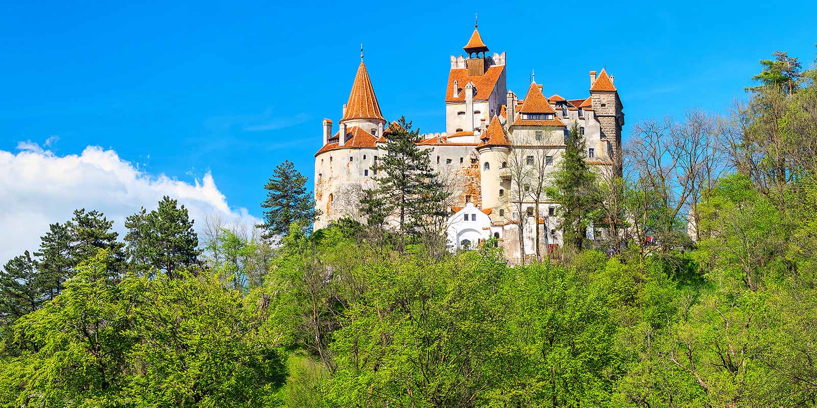 Bran Castle perched atop a hill in the spring