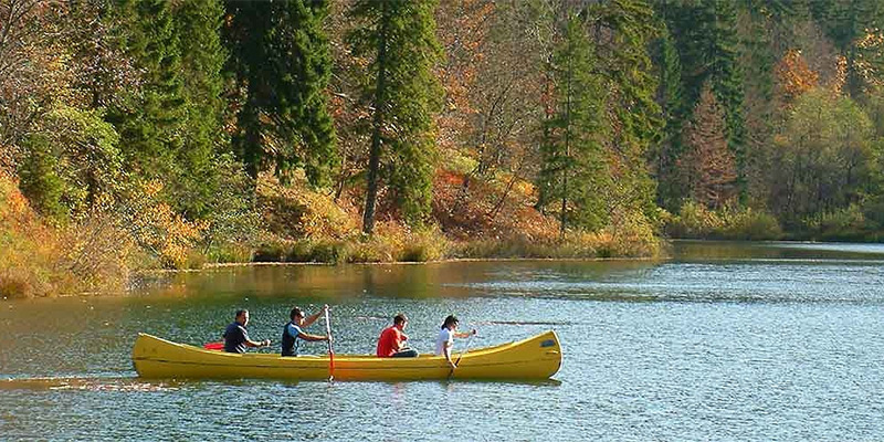Group canoeing on a river in Croatia