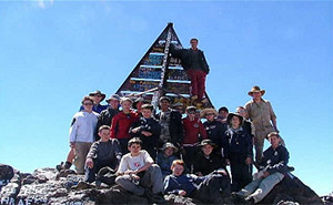 School group celebrating reaching the summit of Mount Toubkal