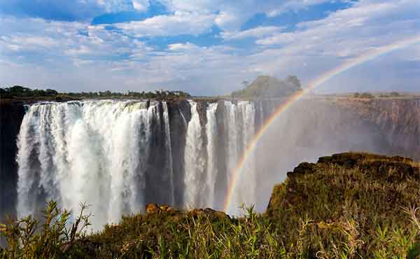 Cascading Victoria Falls with rainbow 