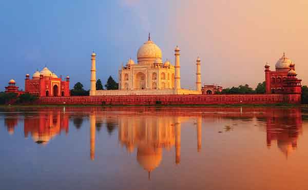 View of Taj Mahal with reflection and red hue