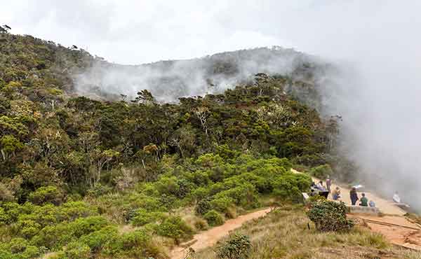 Group at World's End wtih mist rising over Horton Plains
