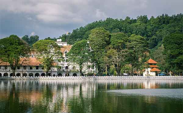 Royal Palace complex housing the Temple of the Tooth with Kandy Lake in foreground