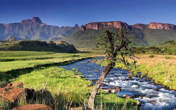 South African river valley with mountain ridge in background.