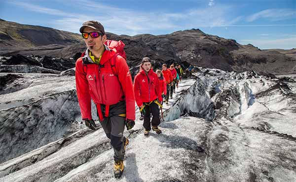 Group hiking on glacier in Iceland with guide