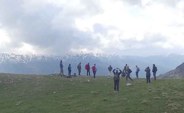 Group of people hiking on mountain in Mavrovo National Park Macedonia