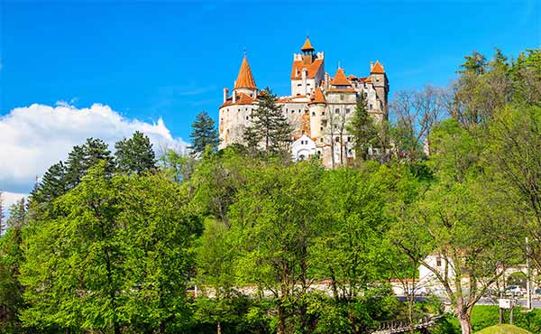 Bran Castle perched atop a hill in the spring