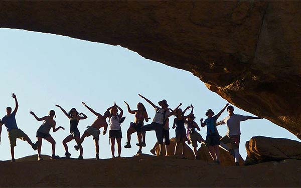Student group poses at Spitzkoppe Natural Arch